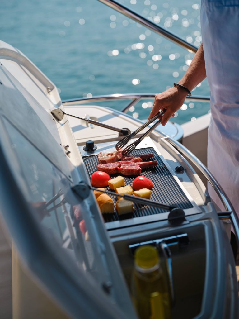private chef grilling on satoshi yacht